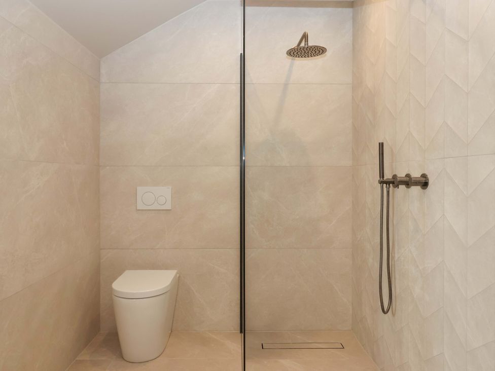 A bathroom with a shower and a toilet at Woldside in York