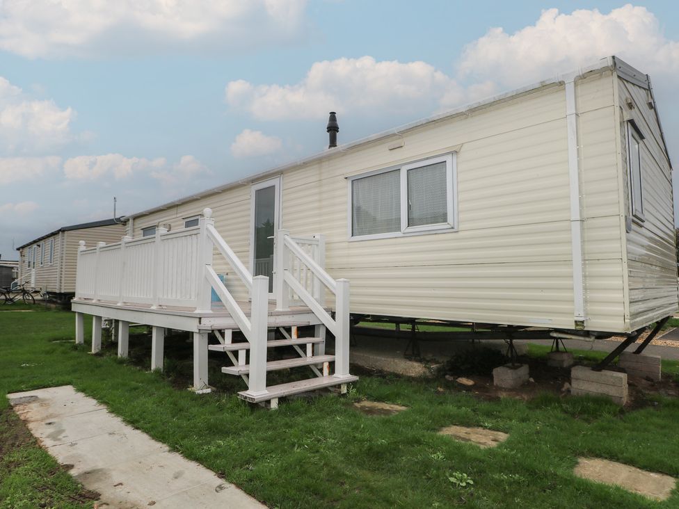A caravan with steps leading to the entrance at 90 Solent Breezes in Southampton
