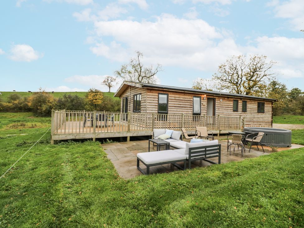 An outdoor patio area with seating at Willow Lodge in Admaston near Abbots Bromley