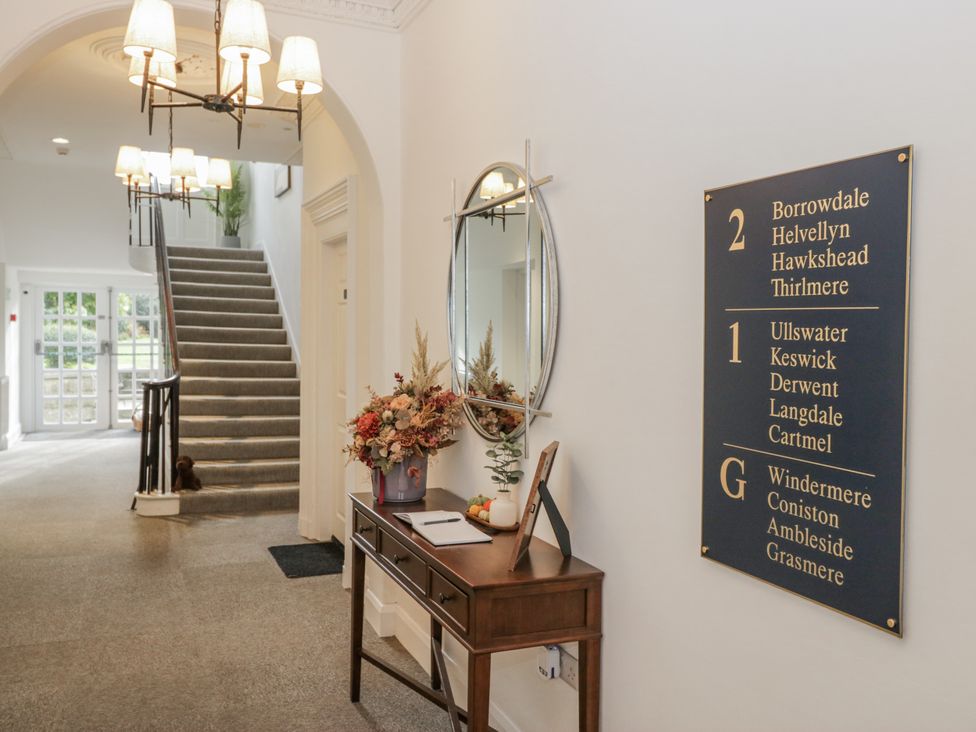 A hallway with a table and a signboard at Derwent in Ulverston