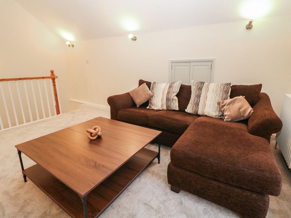 A living room with a sofa and coffee table at Dorset Villas in Matlock