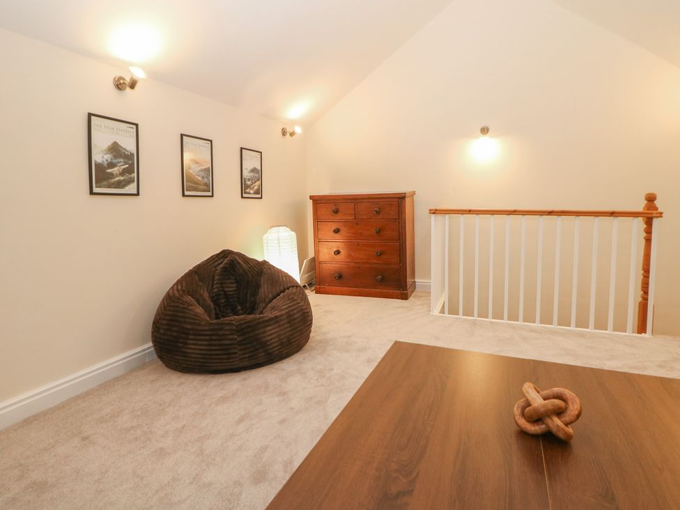 A loft with a bean bag and chest of drawers at Dorset Villas in Matlock