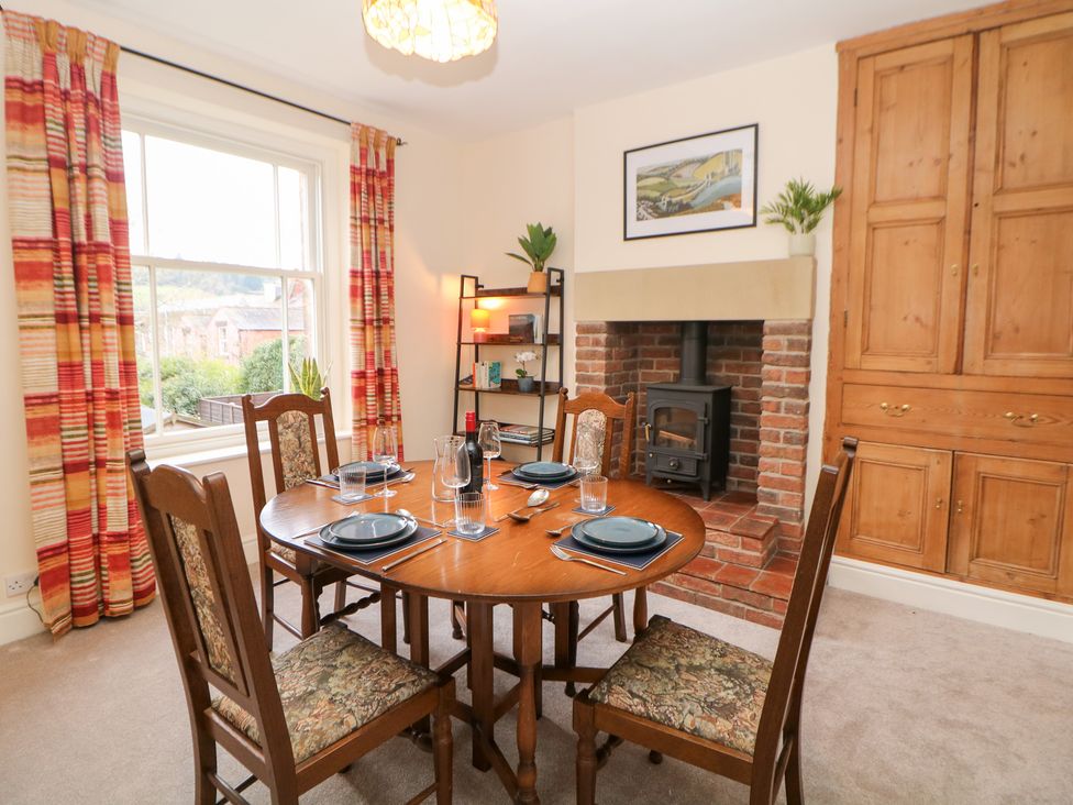 A dining room with a table and chairs at Dorset Villas in Matlock