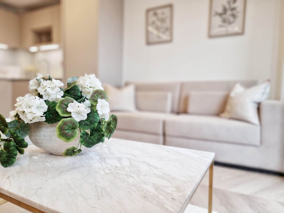 A living room with a coffee table and sofa at The Old Barn in Manchester
