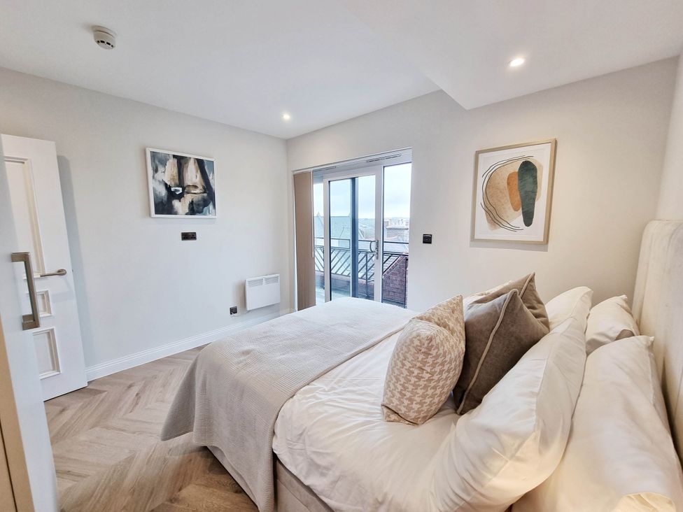 A bedroom with a bed and door at the property in an unspecified location