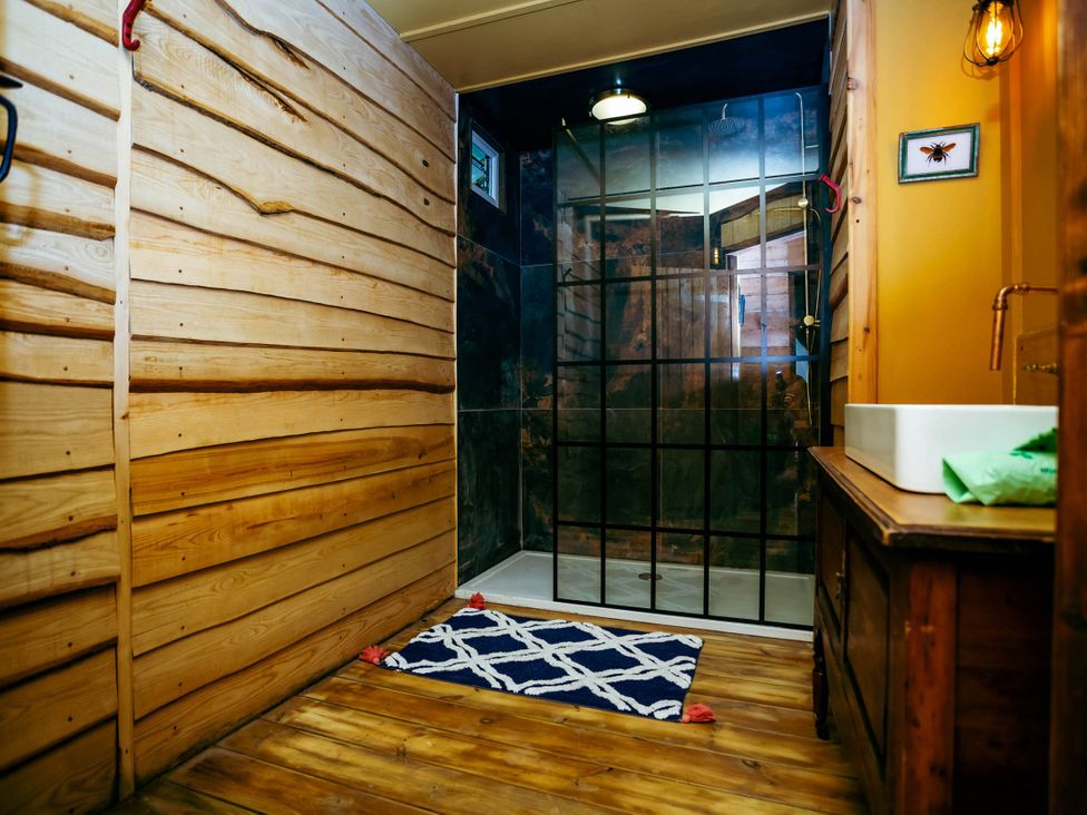 A bathroom with a shower and sink at the property