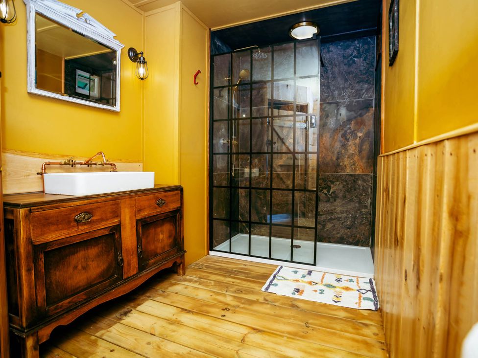 A bathroom with a sink and shower at The Old Barn in Manchester