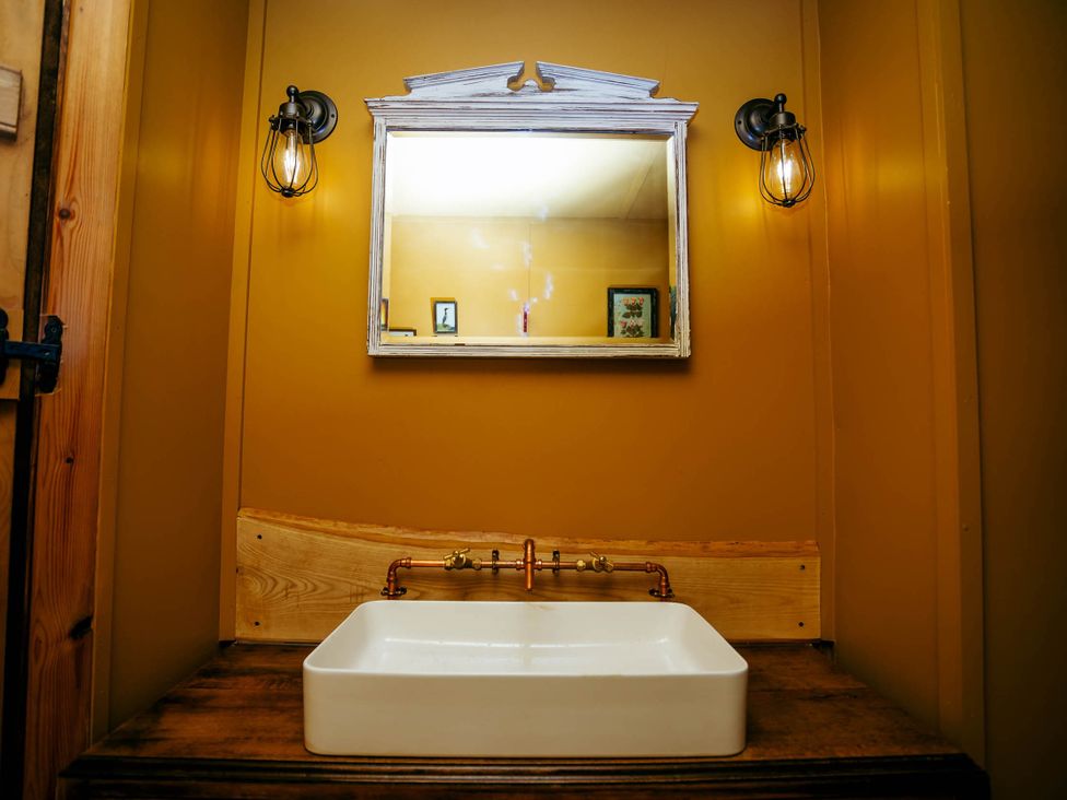 A bathroom with a sink and mirror at the property