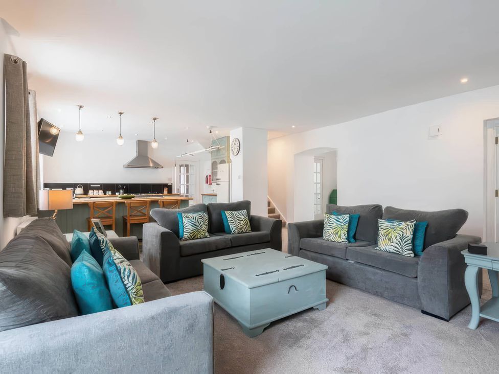 A living room with sofas and a coffee table at The Old Barn in Manchester