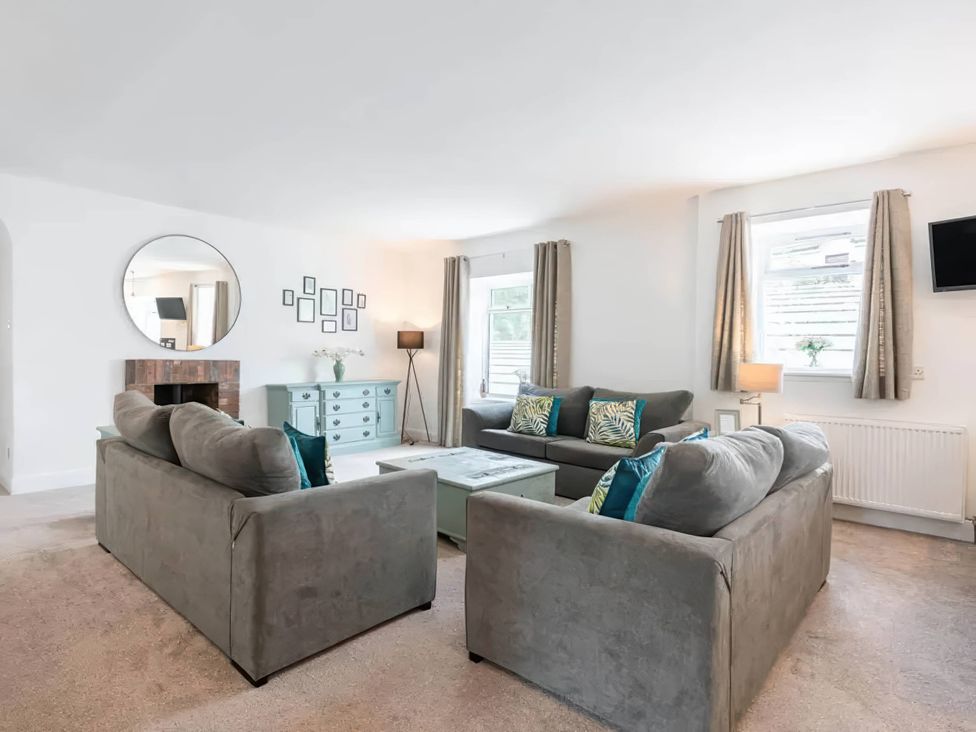 A living room with sofas and a coffee table at the property located in unspecified location