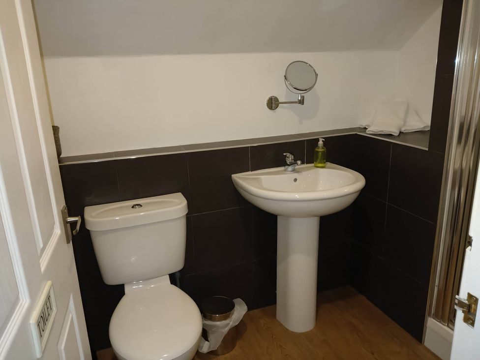 A bathroom with a toilet and sink at a property
