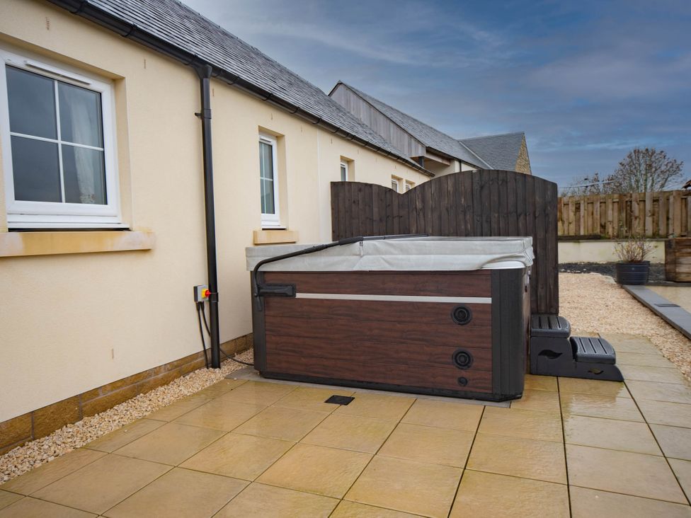 A hot tub in an outdoor area at the property