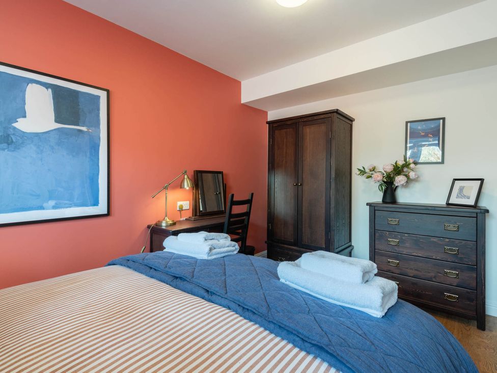 A bedroom with a bed and furniture at the property in unspecified location