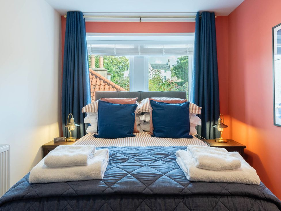 A bedroom with a bed and pillows at The Old Barn in Manchester
