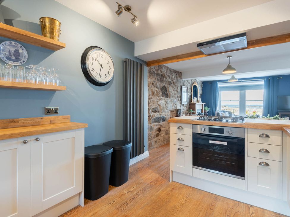 A kitchen with counter and cabinets at the property in unspecified location