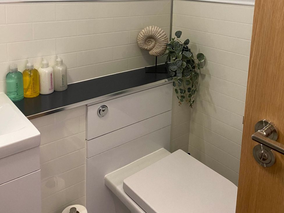 A bathroom with a toilet and sink at 