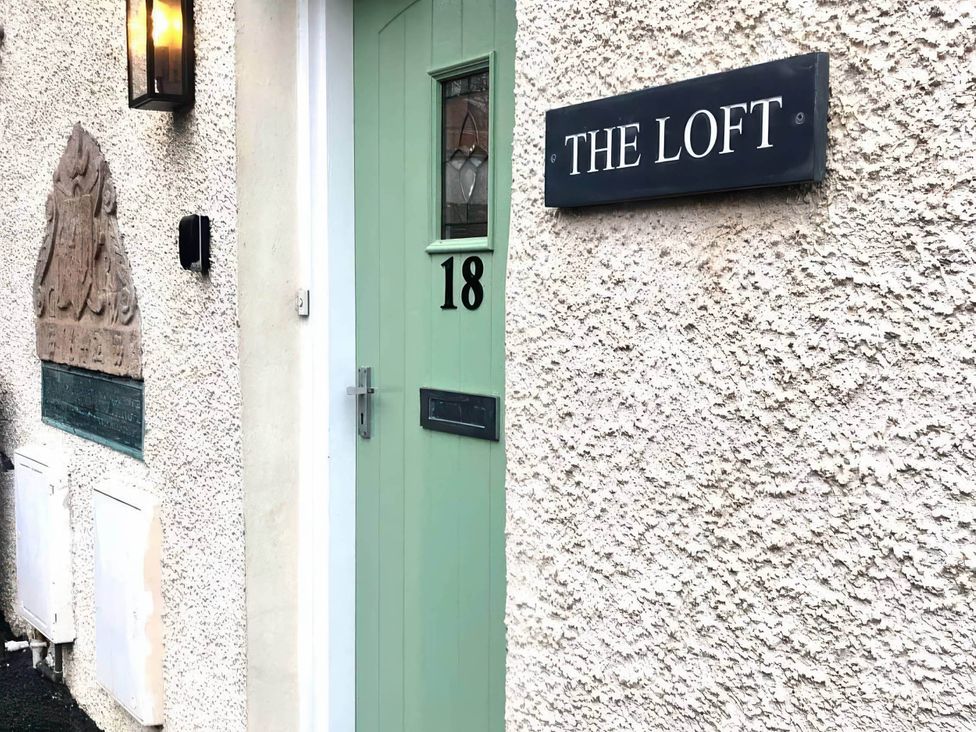 A door with number 18 and a nameplate 'The Loft' at the property