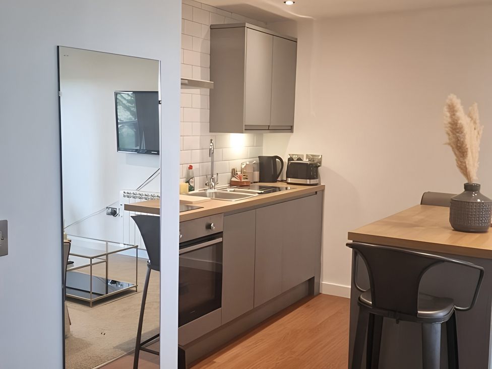 A kitchen with a sink and appliances at Rutland Apartment 