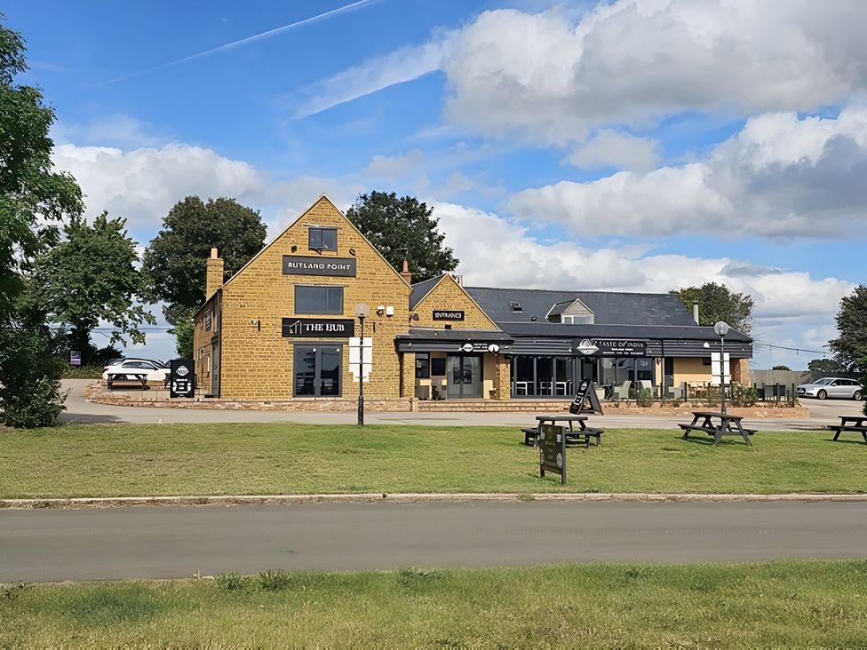 A building with outdoor seating area at Rutland Apartment 