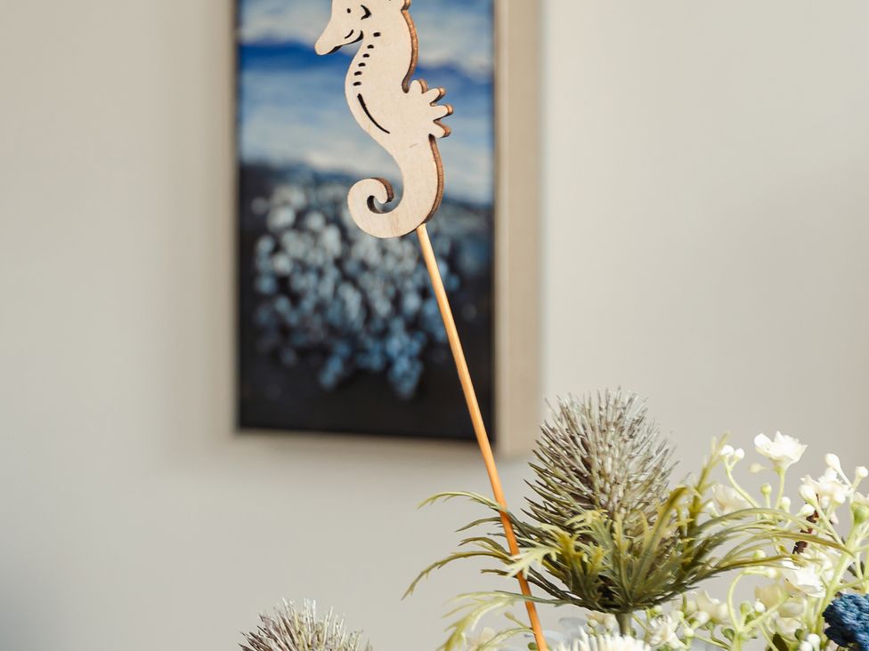 A seahorse decoration in a floral arrangement at Wee Jules By The Sea