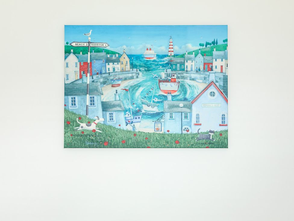 A painting of a coastal scene with boats and buildings at Wee Jules By The Sea