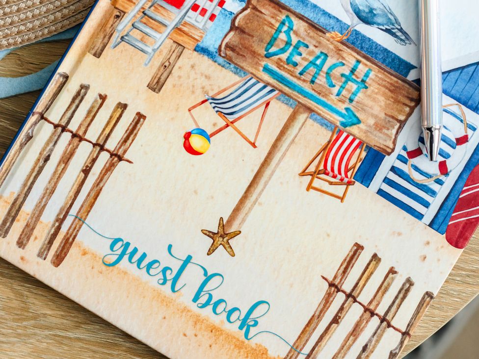 A guest book with beach theme elements at Wee Jules By The Sea