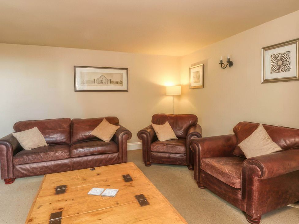 A living room with sofas and a coffee table
