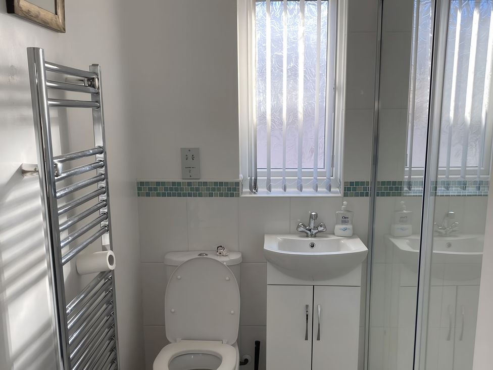 A bathroom with a sink and toilet at Ivy Corner