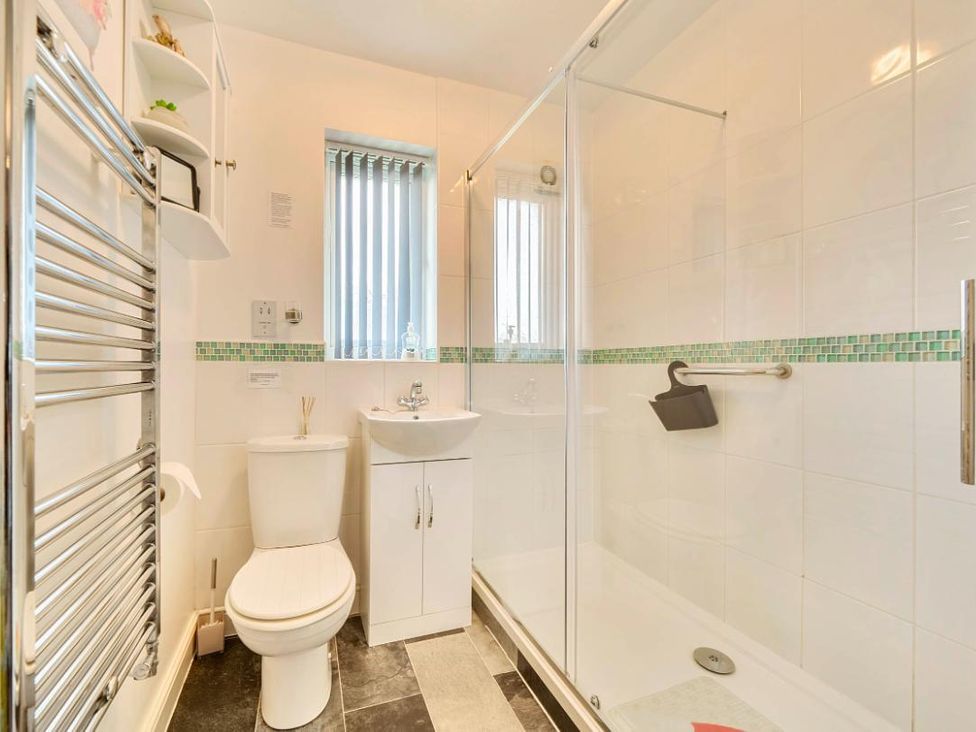 A bathroom with a shower and sink at Ivy Corner in Bridlington