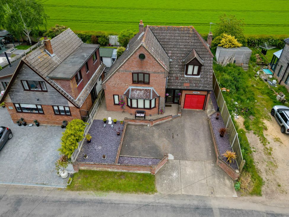 A house with a garage and driveway at The Old Barn in Manchester