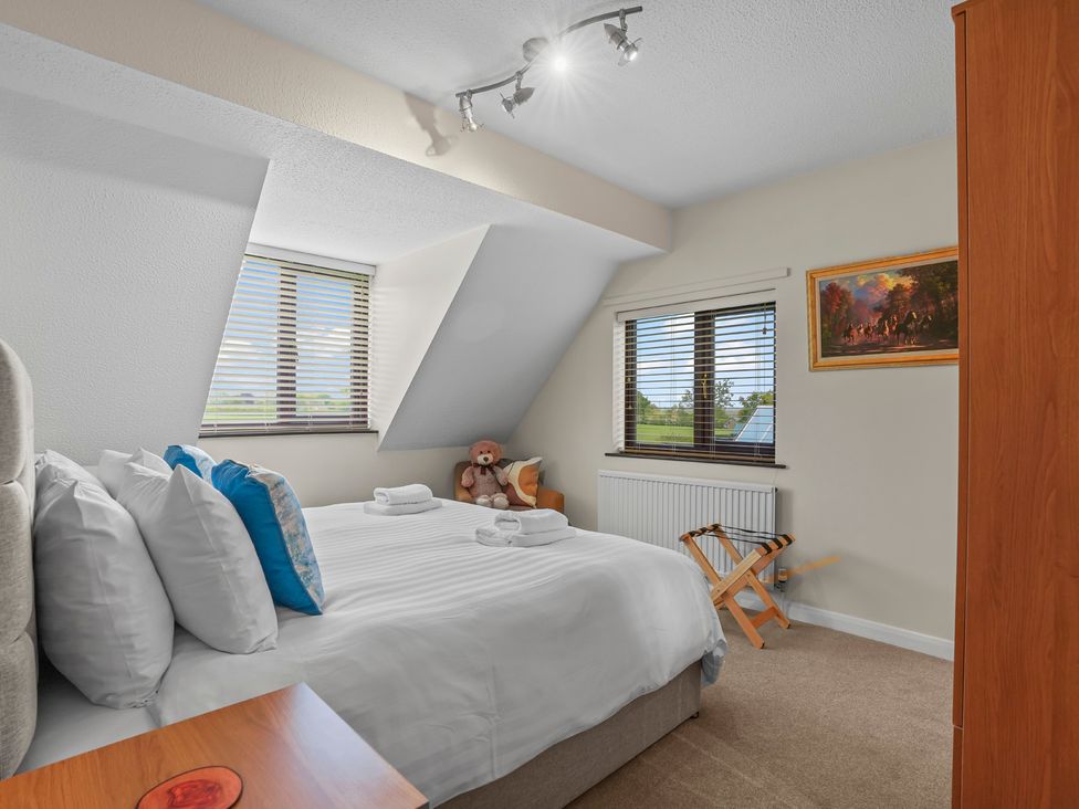 A bedroom with a bed and window at The Old Barn in Manchester