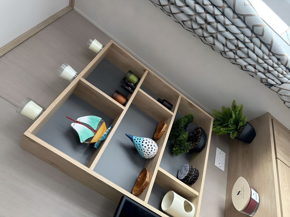 A shelf with decorative items and candles at Pine 48