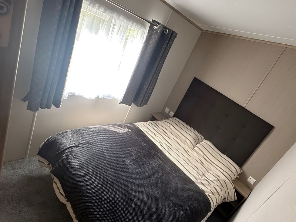 A bedroom with a bed and window at Pine 48