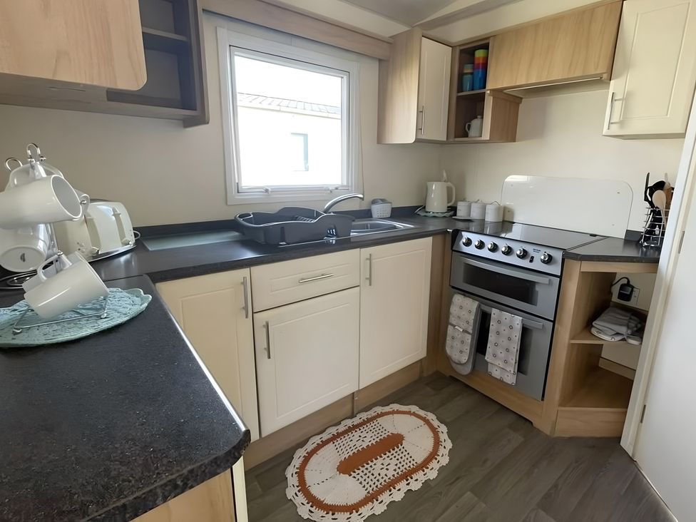 A kitchen with sink and oven at 214 Oaklands Area
