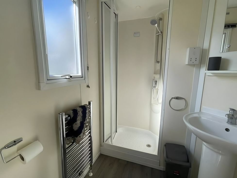 A bathroom with a shower and sink at 214 Oaklands Area