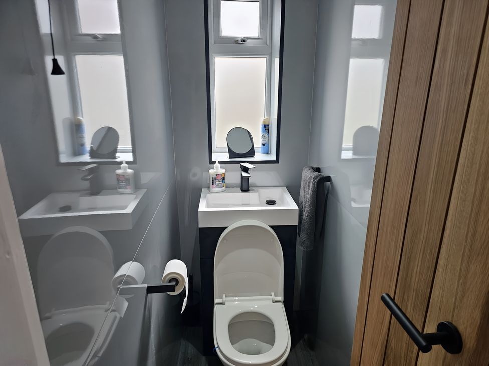 A bathroom with a toilet and sink at 58 Clifton Rise