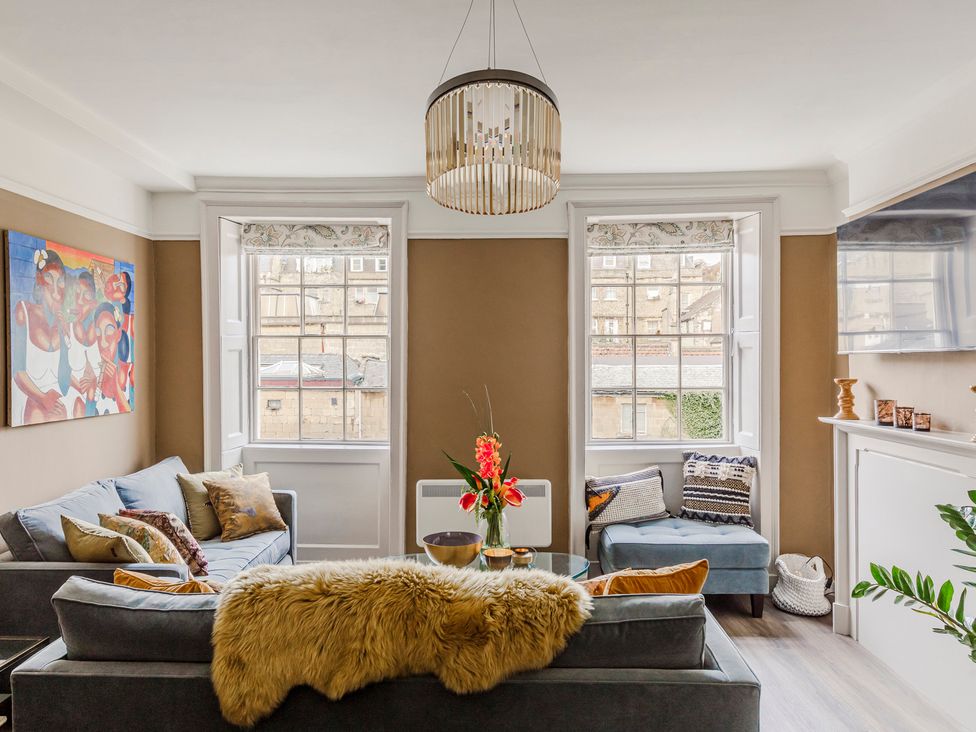 A living room with a couch and coffee table at Stay Robun
