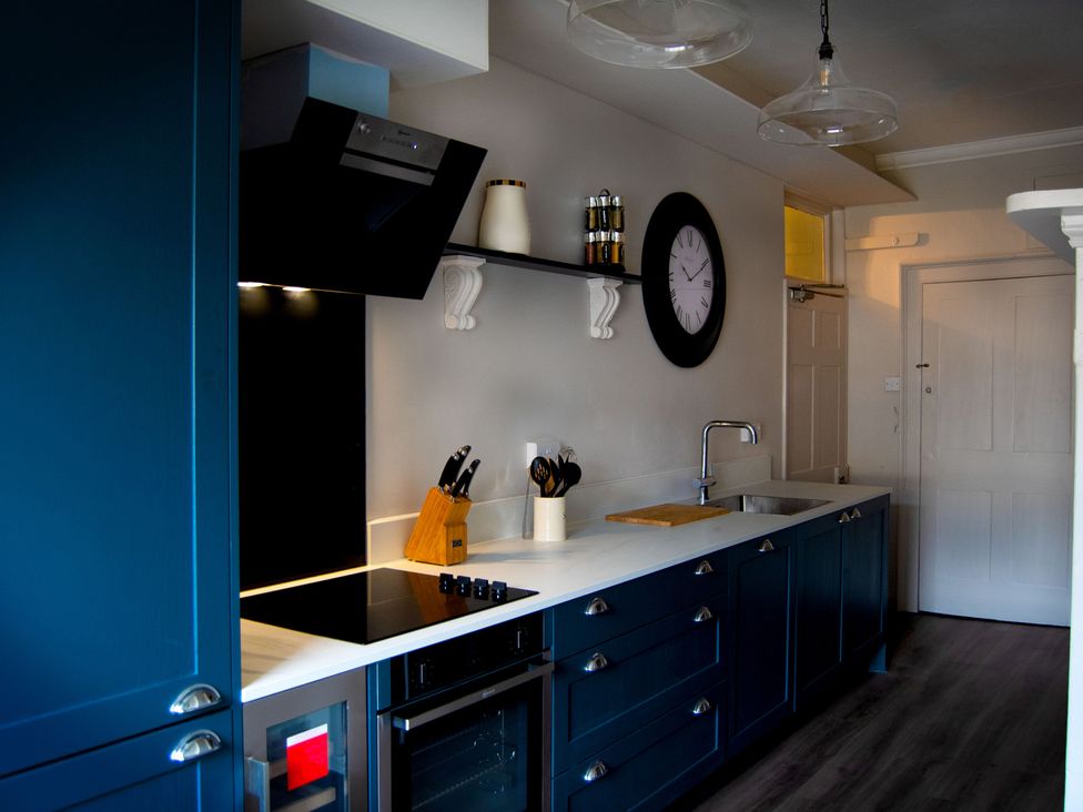 A kitchen with appliances and utensils at Stay Robun