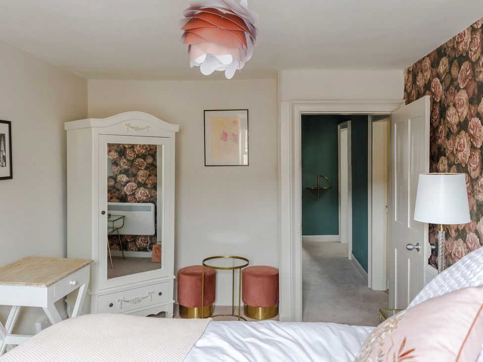 A bedroom with a bed and wardrobe at Stay Robun in 