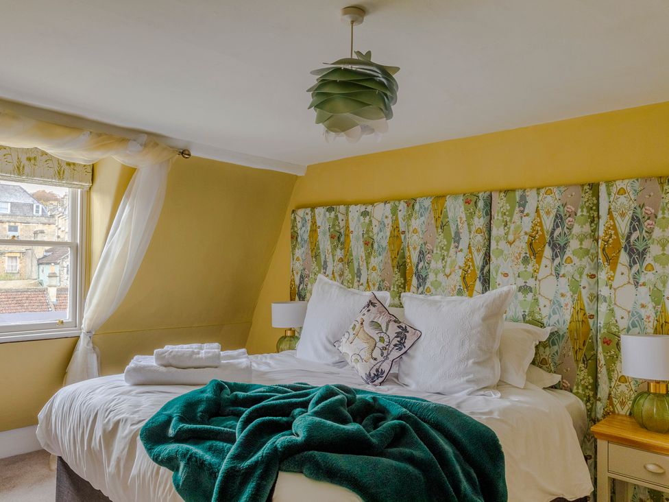 A bedroom with a bed and window at Stay Robun