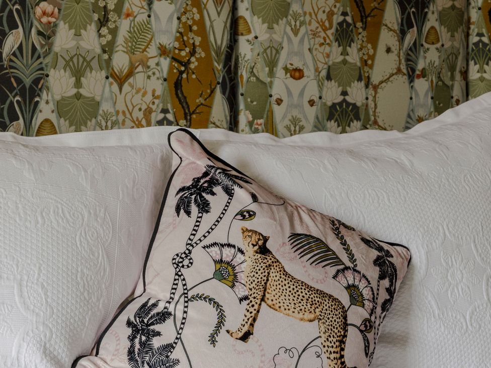 A pillow with animal print on bedding at Stay Robun