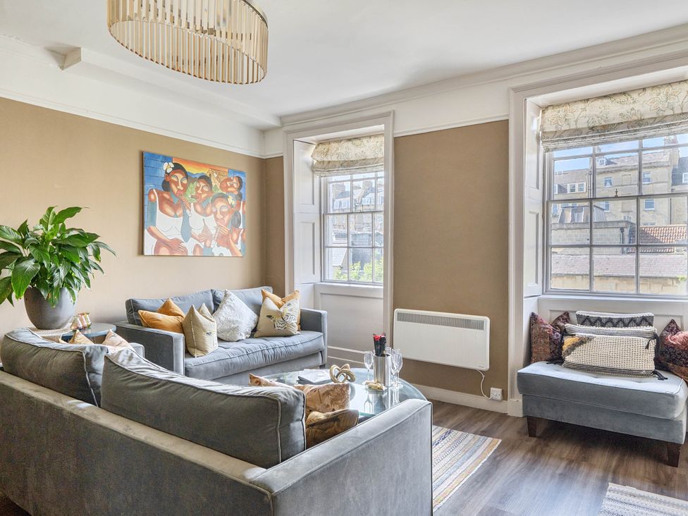 A living room with a sofa and coffee table at Stay Robun in Bath