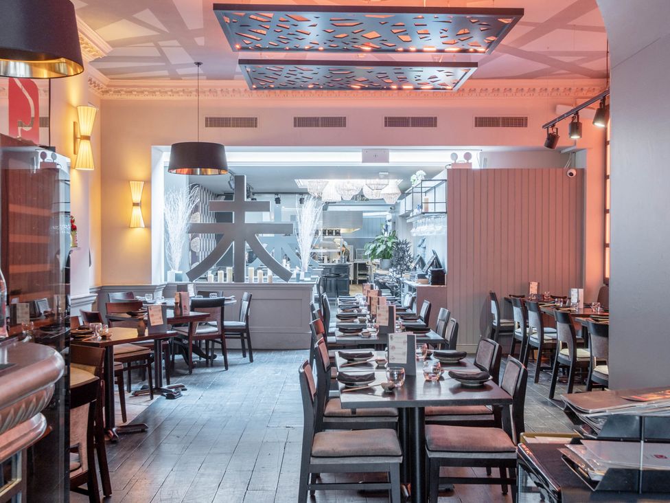 A dining room with tables and chairs at Stay Robun in Bath