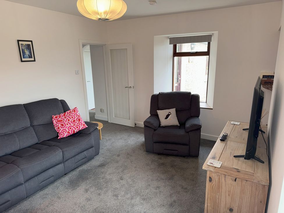 A living room with a sofa and television at Withi-Gill