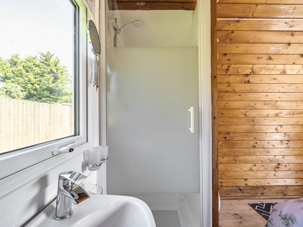 A bathroom with a sink and shower at St Austell Glamping in St Austell