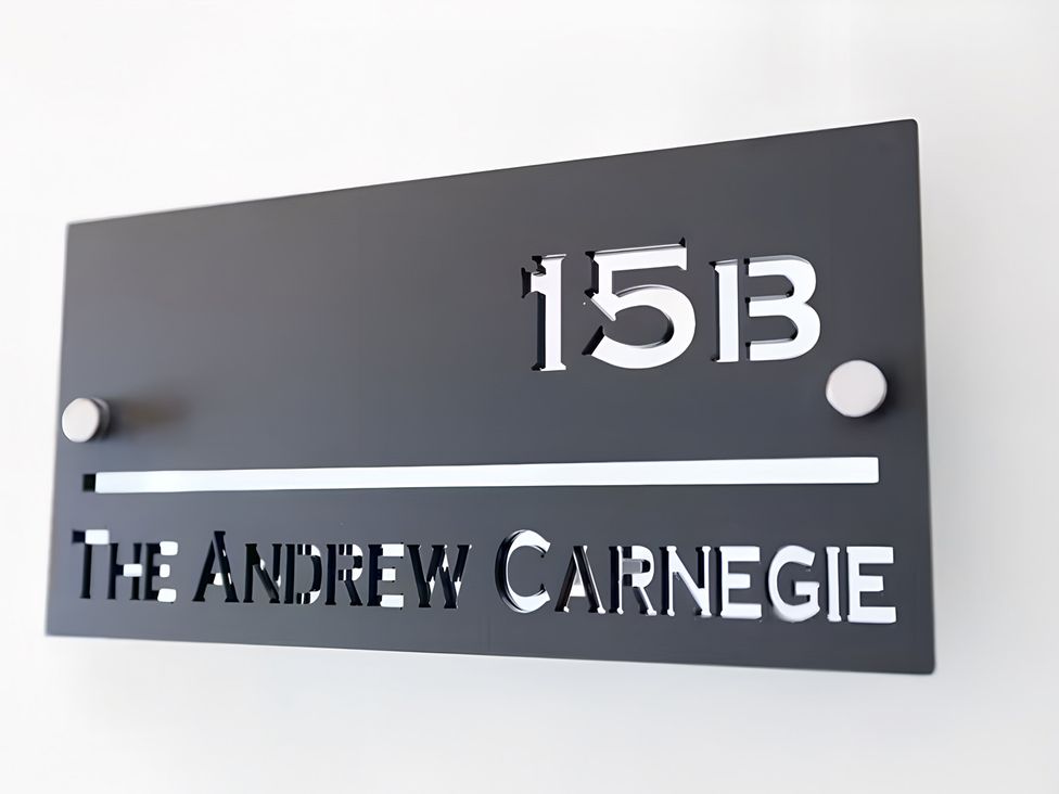 A sign displaying 15B and The Andrew Carnegie at 15B Kirkgate