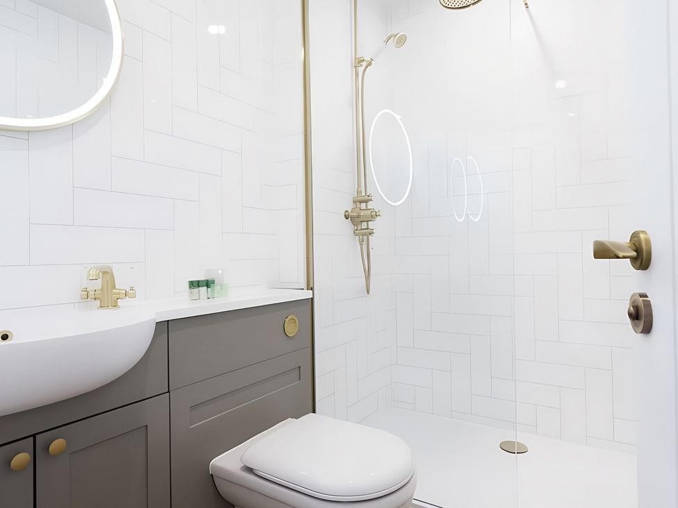 A bathroom with a sink and shower at 15B Kirkgate