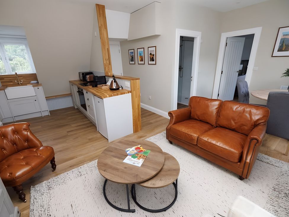 A living room with a sofa and coffee table at 15D Kirkgate