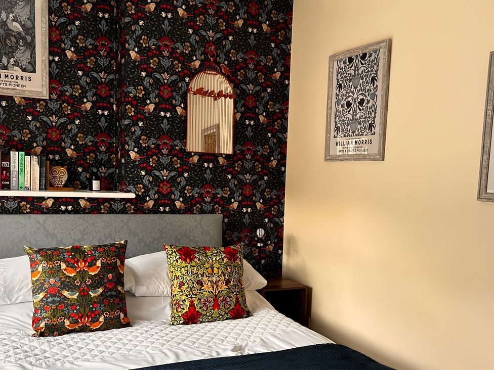 A bedroom with a bed and decorative pillows at the property