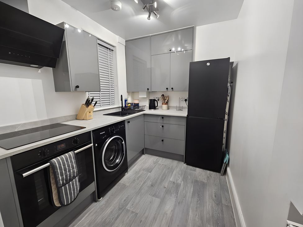 A kitchen with appliances and storage at 140 Finchley Road